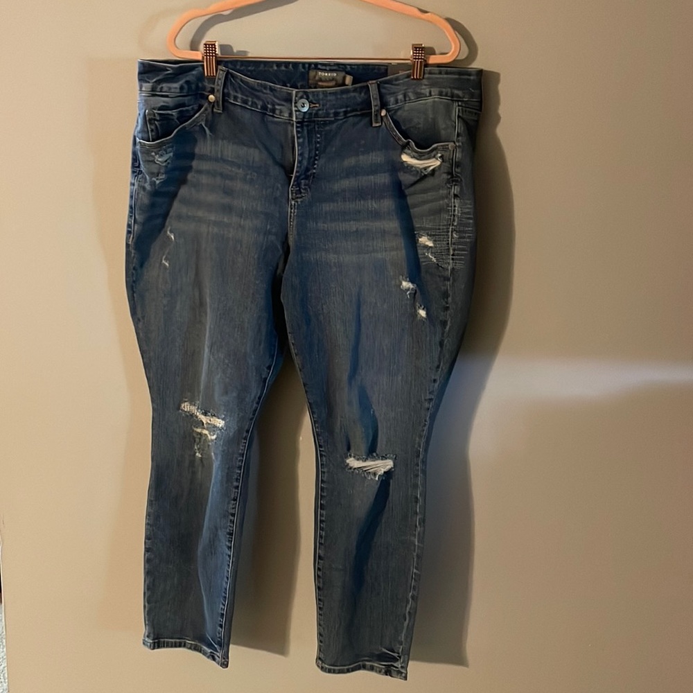 Medium wash midrise distressed skinny jeans